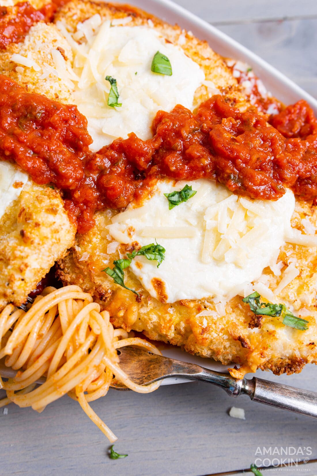 air fryer chicken parmesan on a plate with pasta