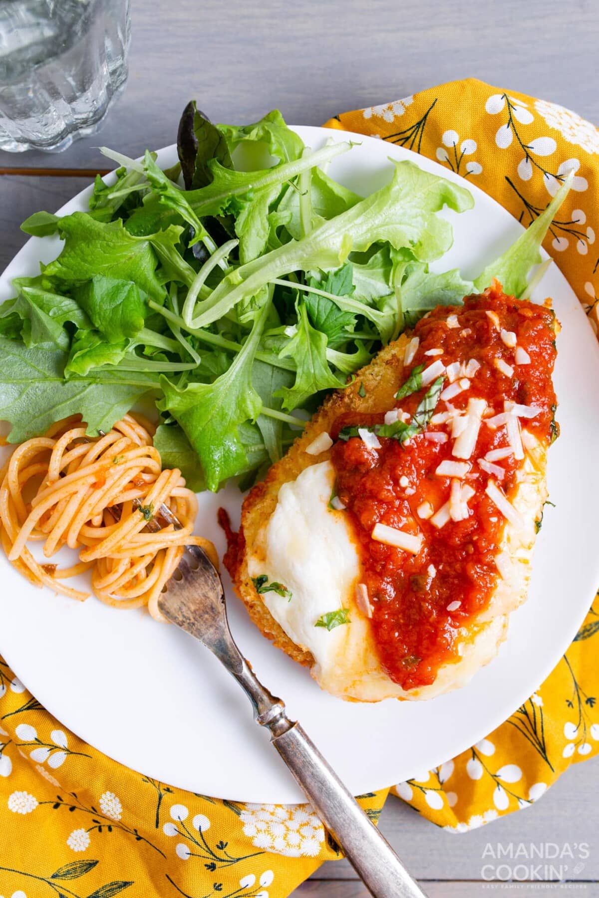 air fryer chicken parm on a plate with salad