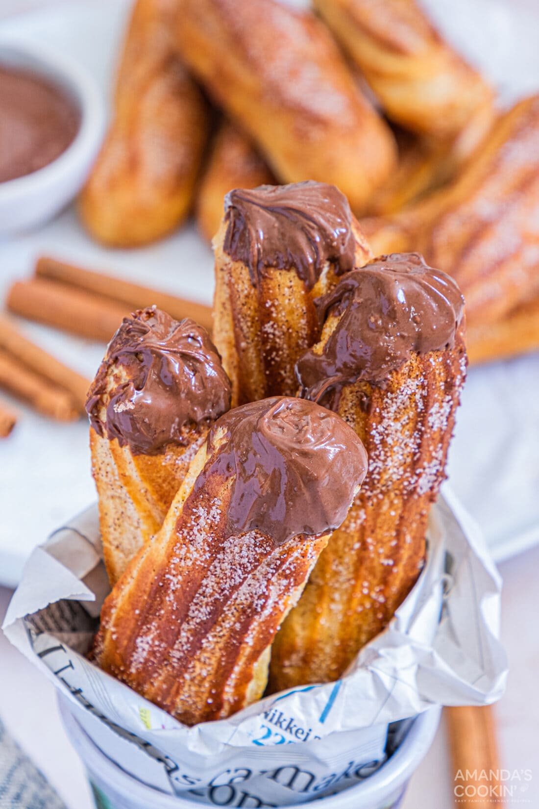 air fryer churros in a cup with chocolate nutella sauce