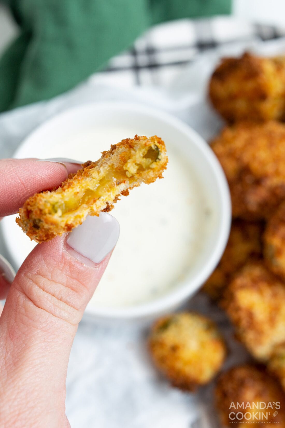 air fryer fried pickle with a bite out of it