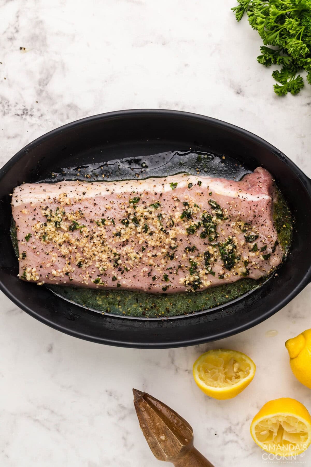 pork tenderloin marinating in a dish