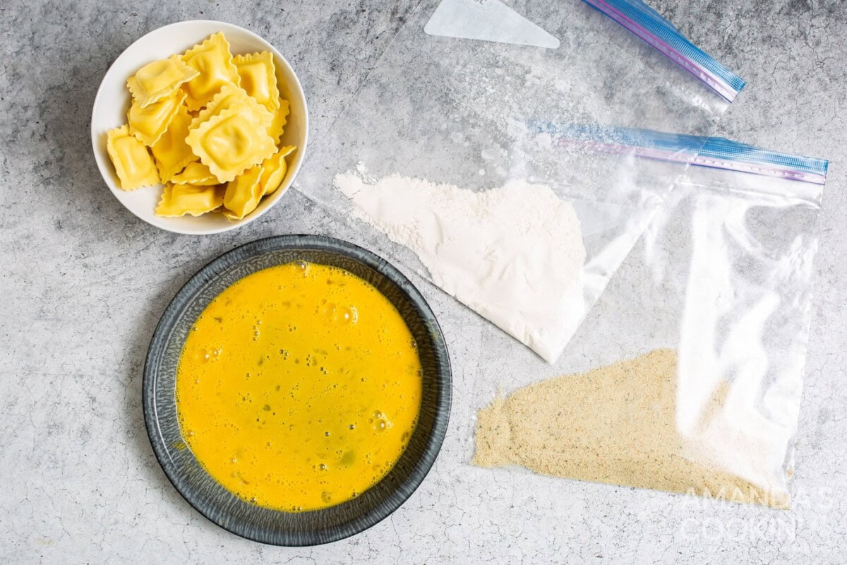 flour and breadcrumbs in a bag with egg wash in a bowl