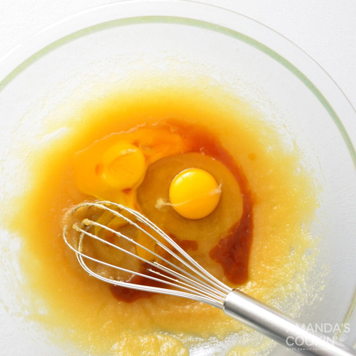 whisking wet ingredients into dry ingredients in a bowl