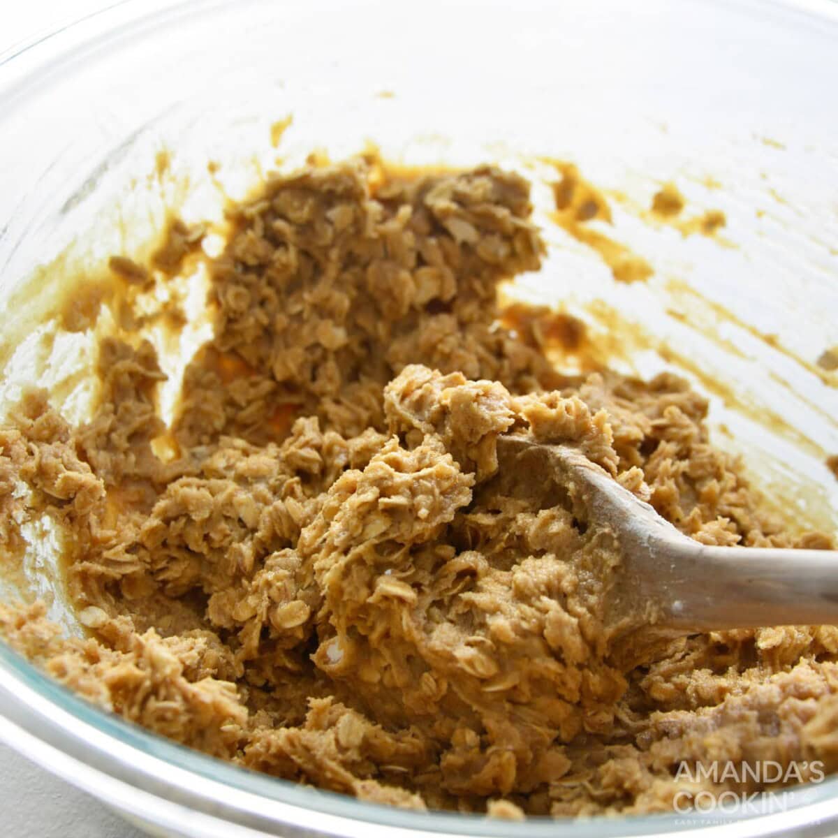 mixing cookie dough with a wooden spoon