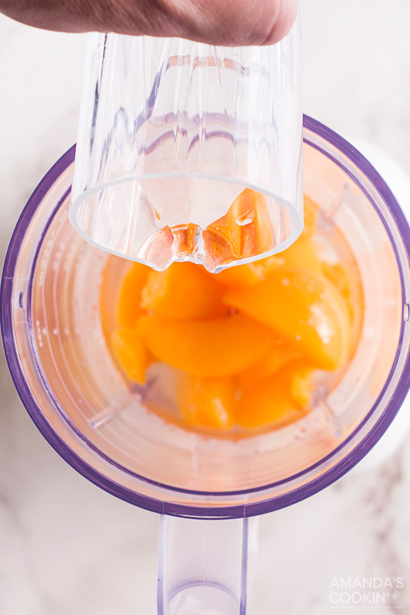 chopped peaches and simple syrup in a blender