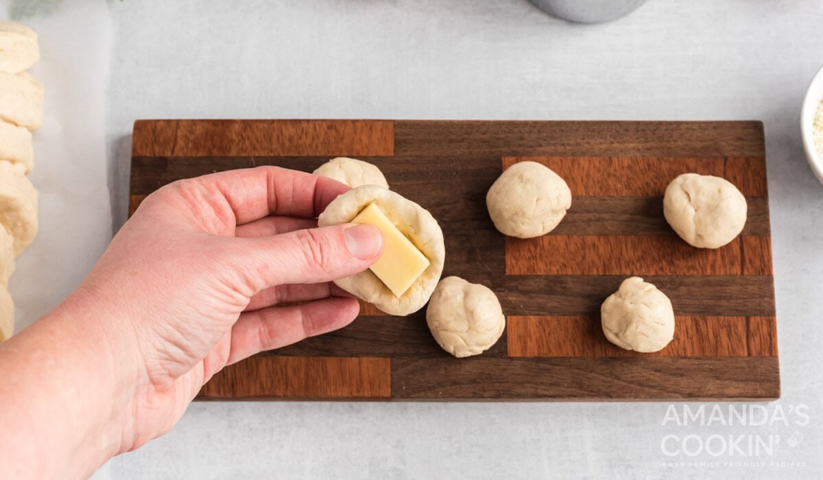placing cheese inside biscuit