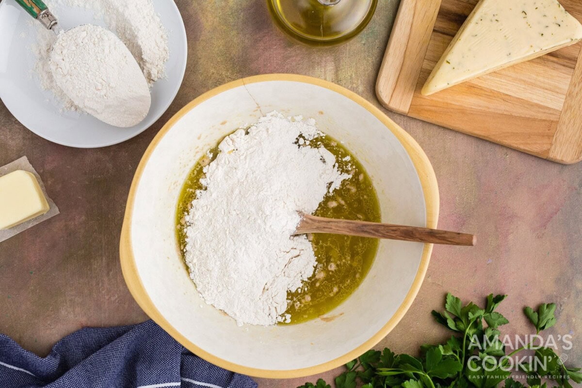 flour in a bowl of yeast and water