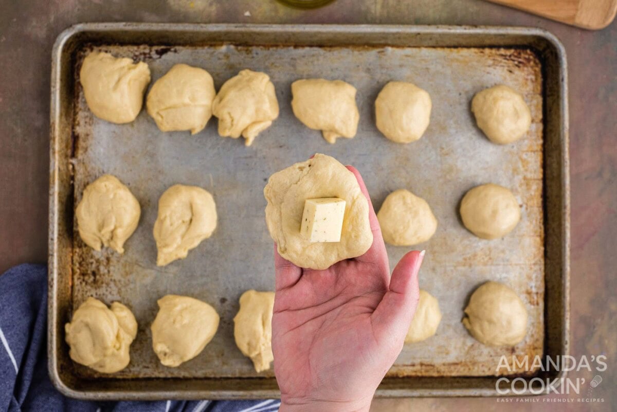 adding cheese to dough