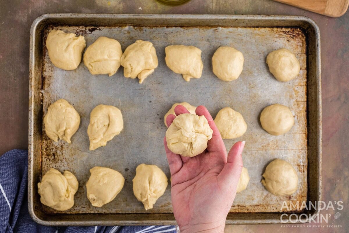 pinched dough ball in a hand