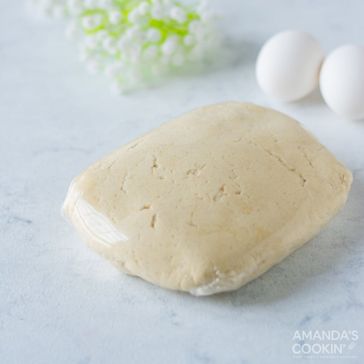 dough ball wrapped in cling wrap