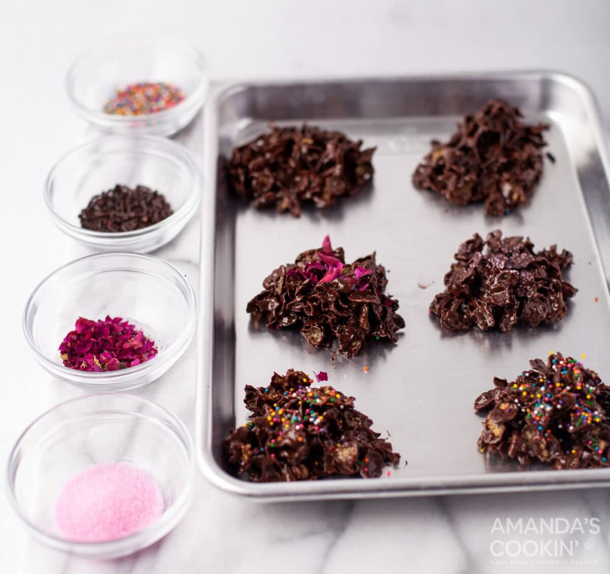 adding toppings to chocolate cornflake cookies