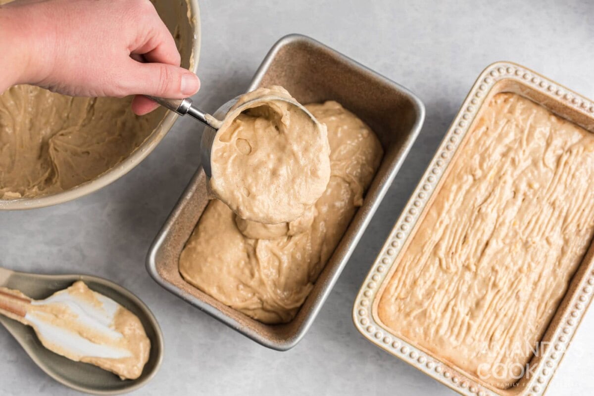 adding banana bread batter to loaf pan