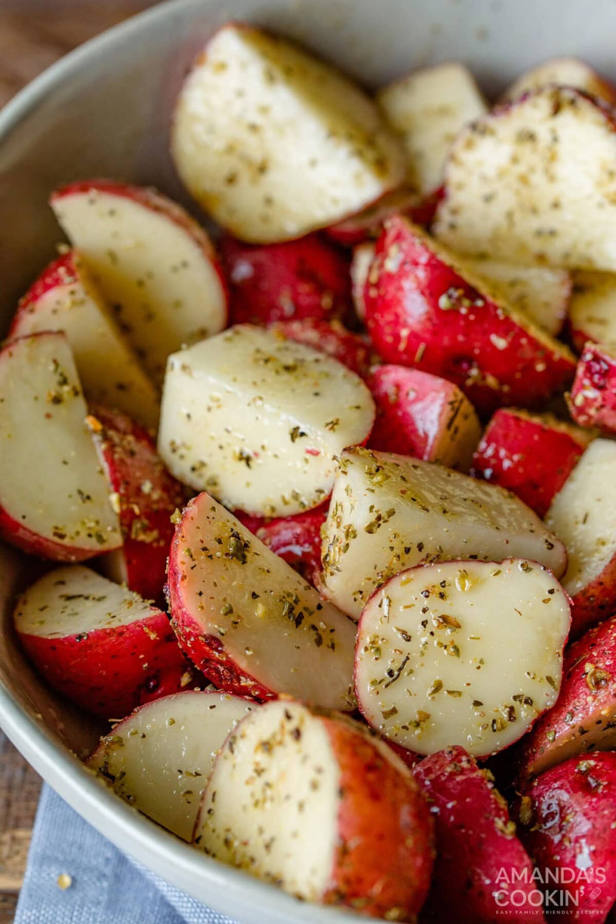 cubed potatoes in a bowl with seasoning