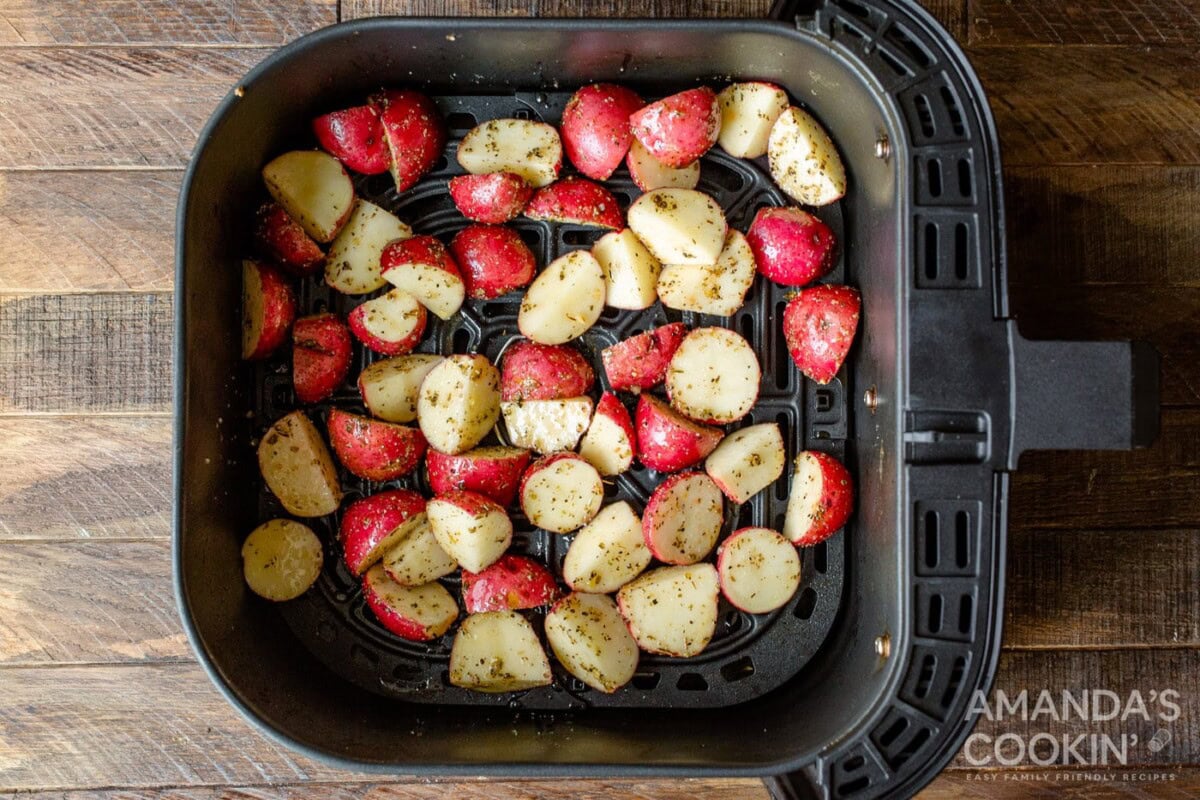cubed potatoes in air fryer basket