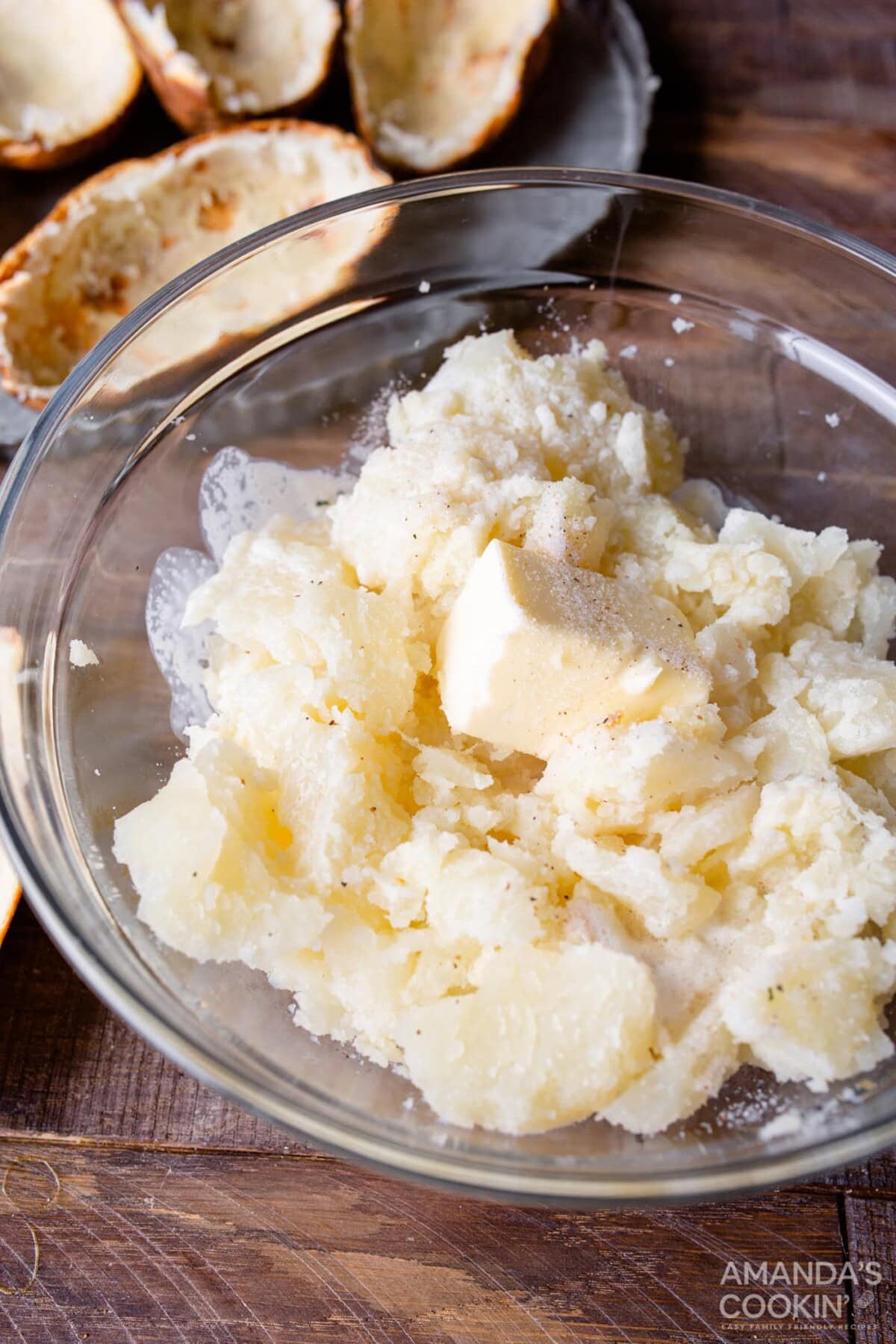 potato and butter in bowl with heavy whipping cream