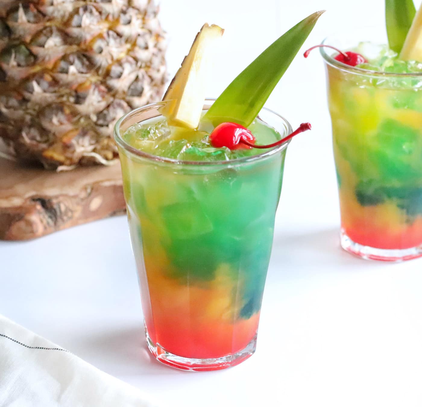 Blue Pineapple with Gold Leaves on Black Background Stock Image