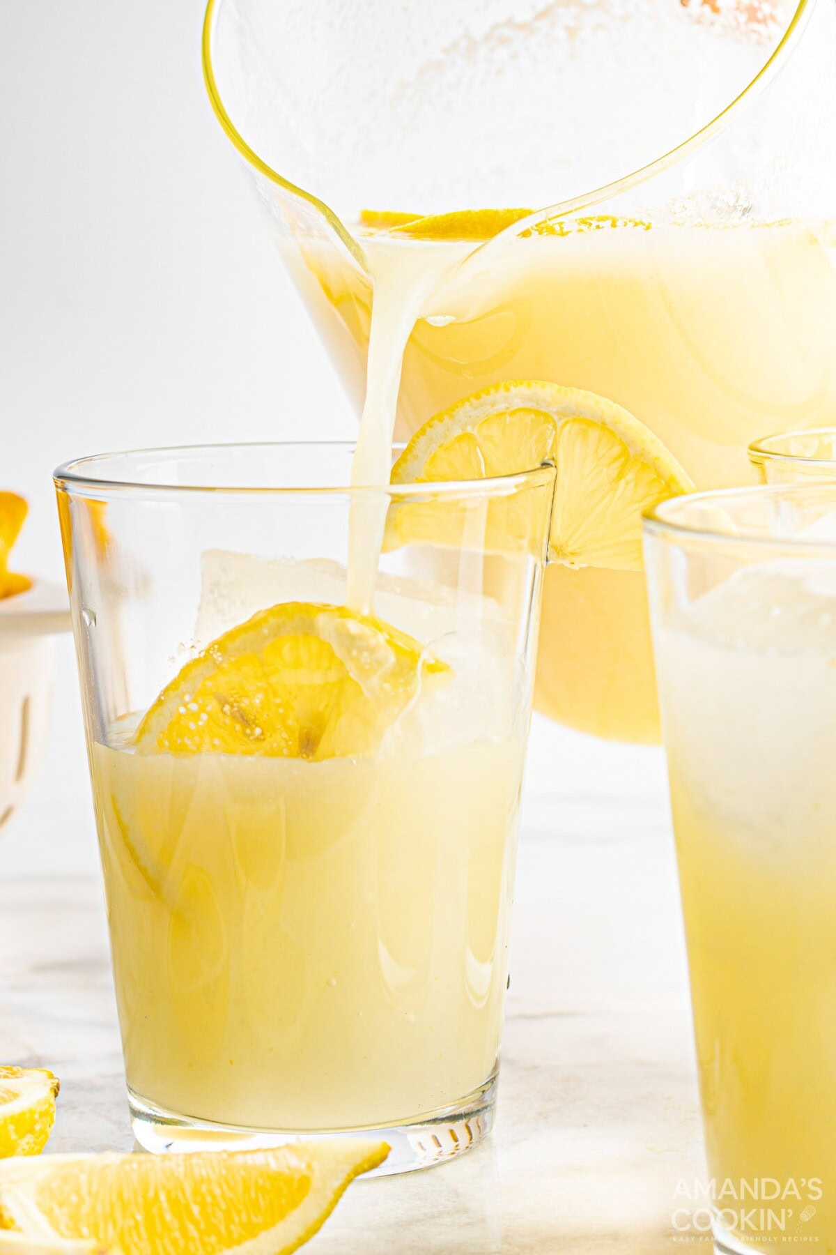 pouring a glass of Frozen Lemonade