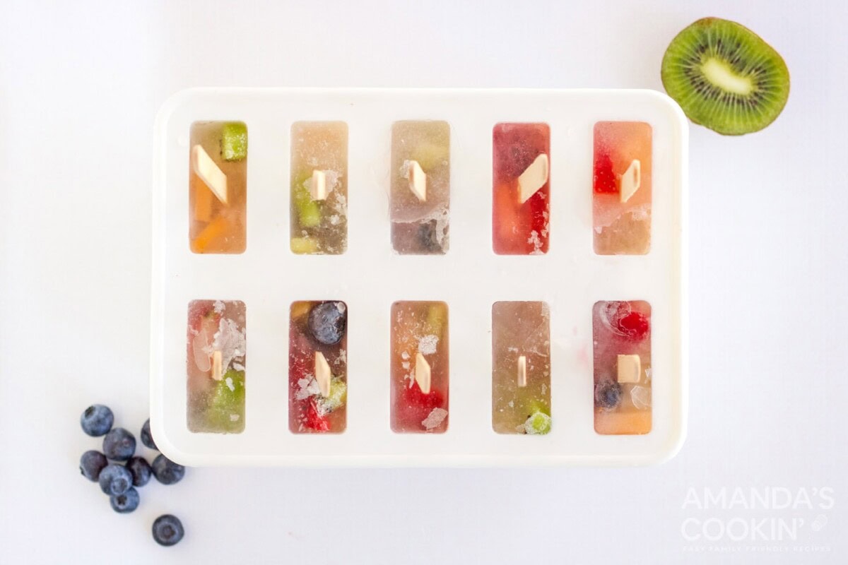 frozen fruit popsicles in a mold