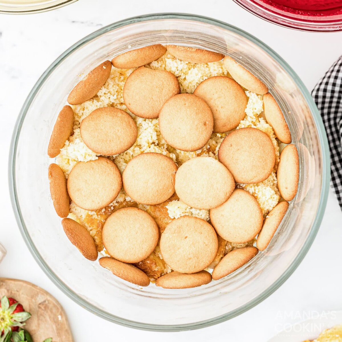 vanilla wafers on top of cake in trifle bowl