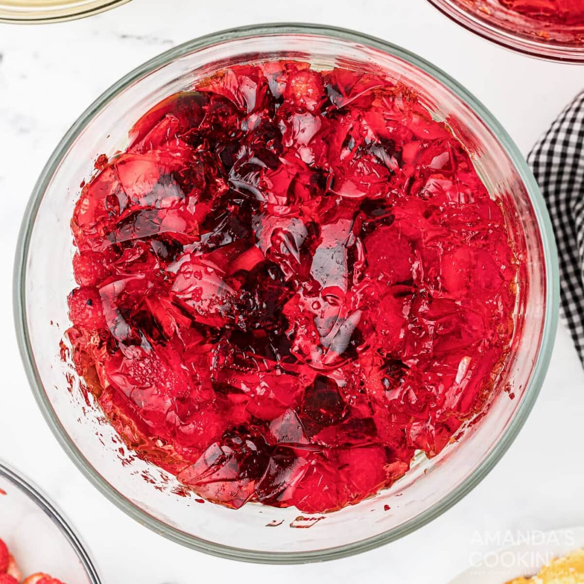 jello on top of fruit in a trifle bowl