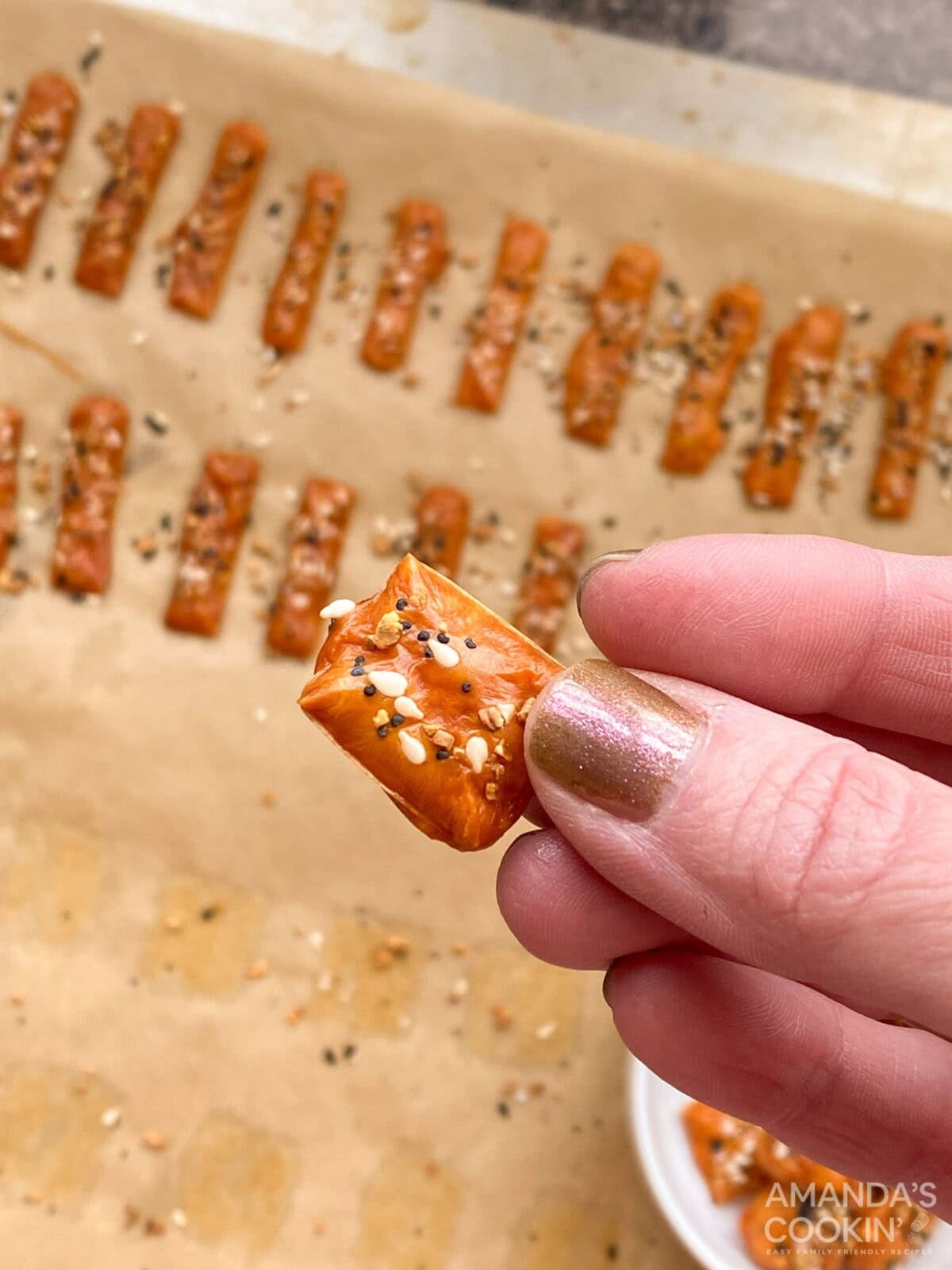 holding a keto cheese cracker