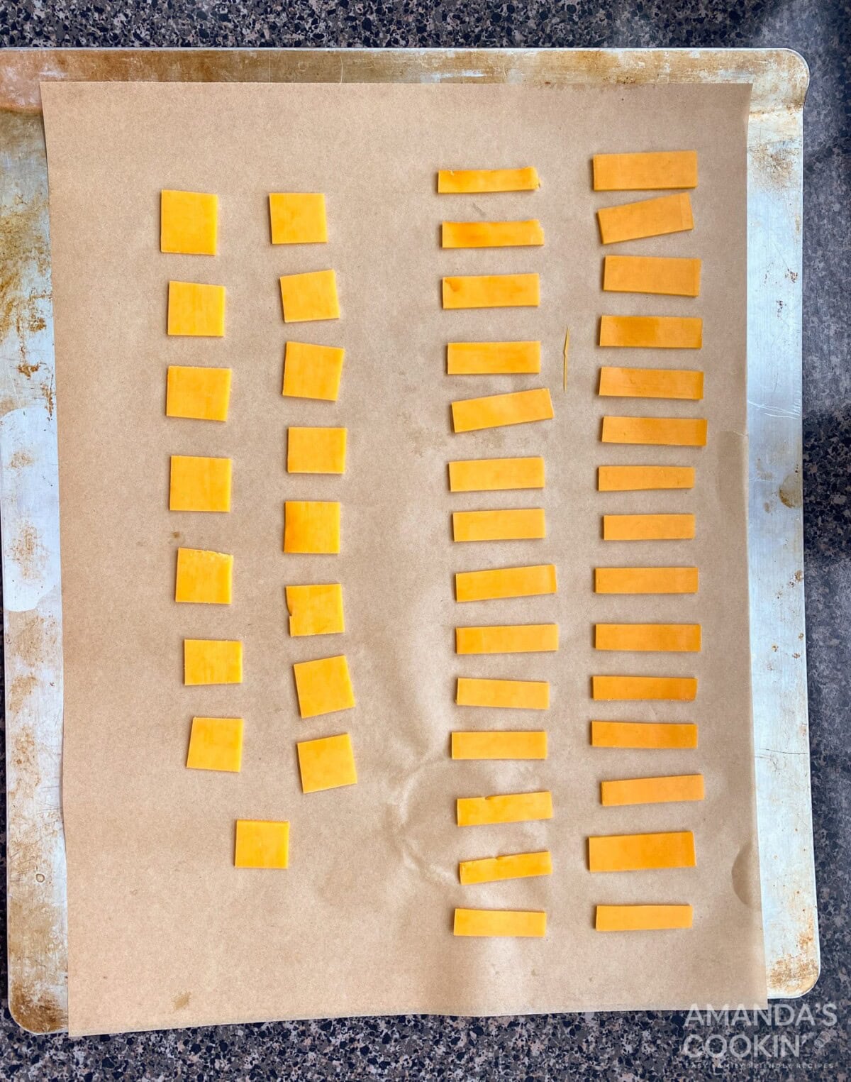 cheese pieces on baking sheet