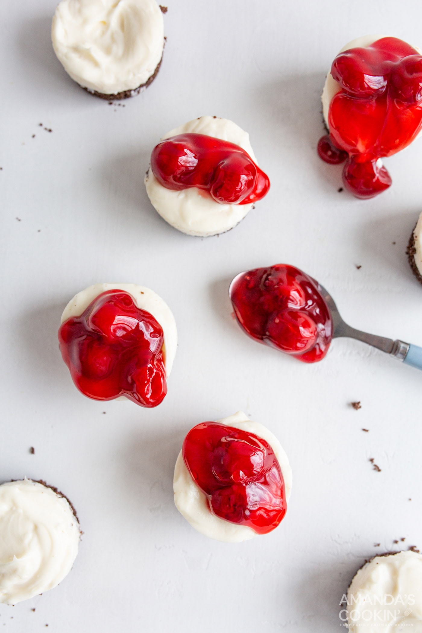 topping mini cheesecakes with cherry pie filling