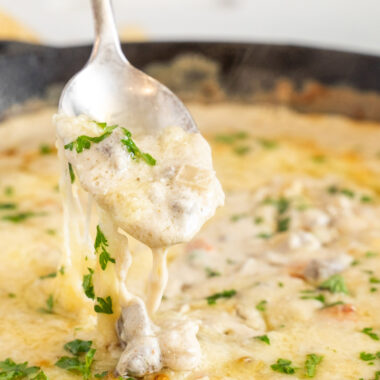 lifting Philly Cheesesteak Dip with a spoon