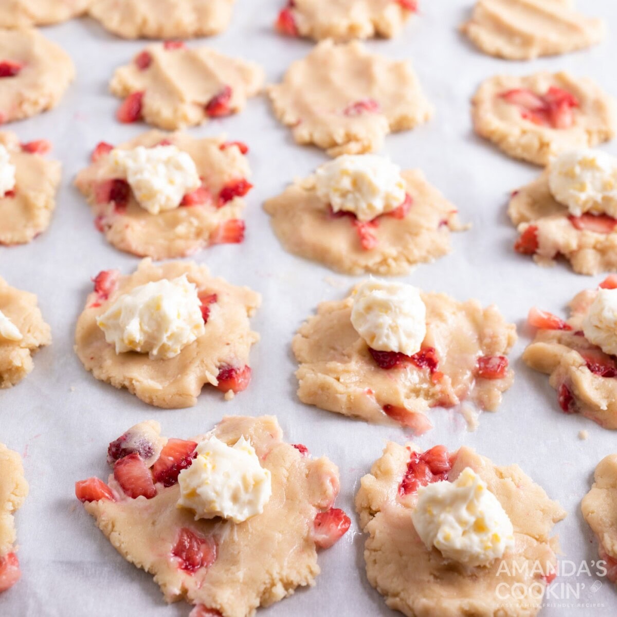 cream cheese balls on top of cookie dough