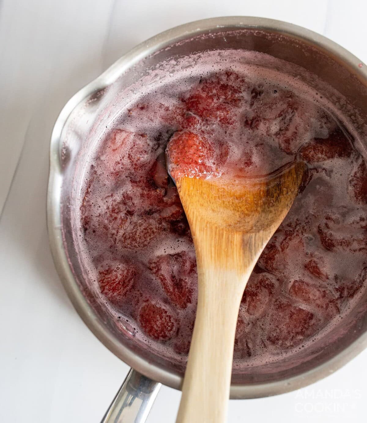 strawberry simple syrup in a saucepan