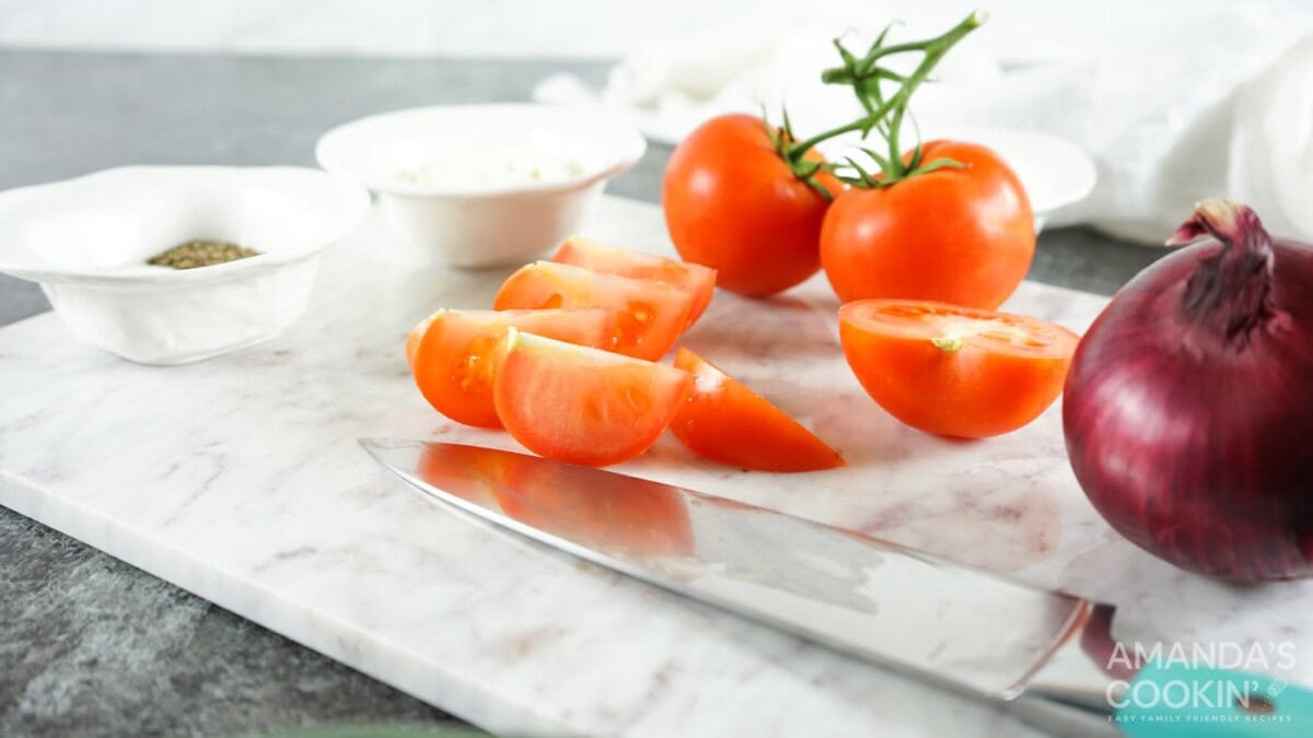 sliced tomatoes on counter
