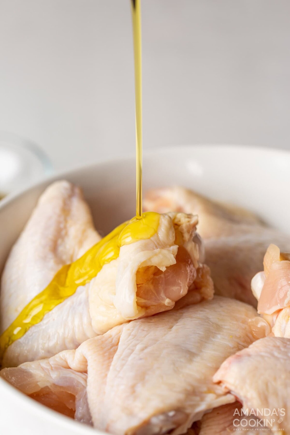 olive oil pour on chicken wings