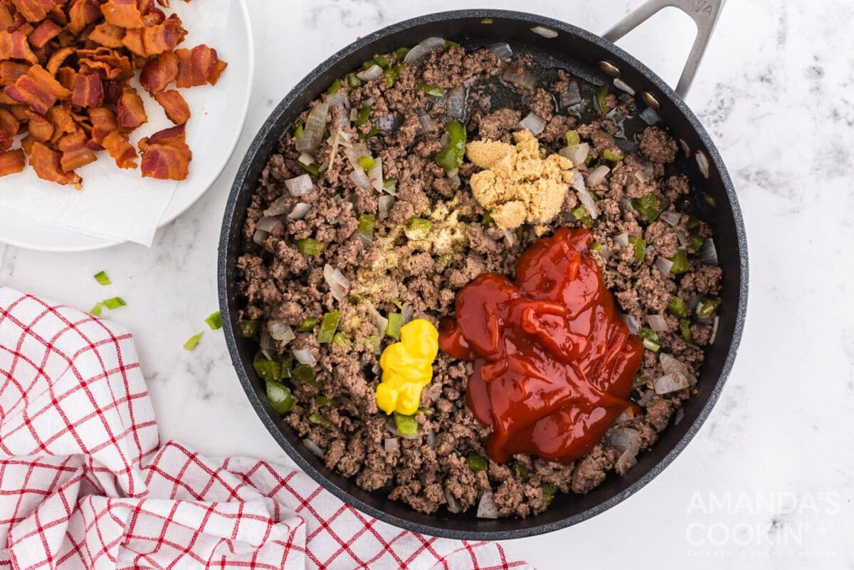 ketchup and mustard in pan with ground beef