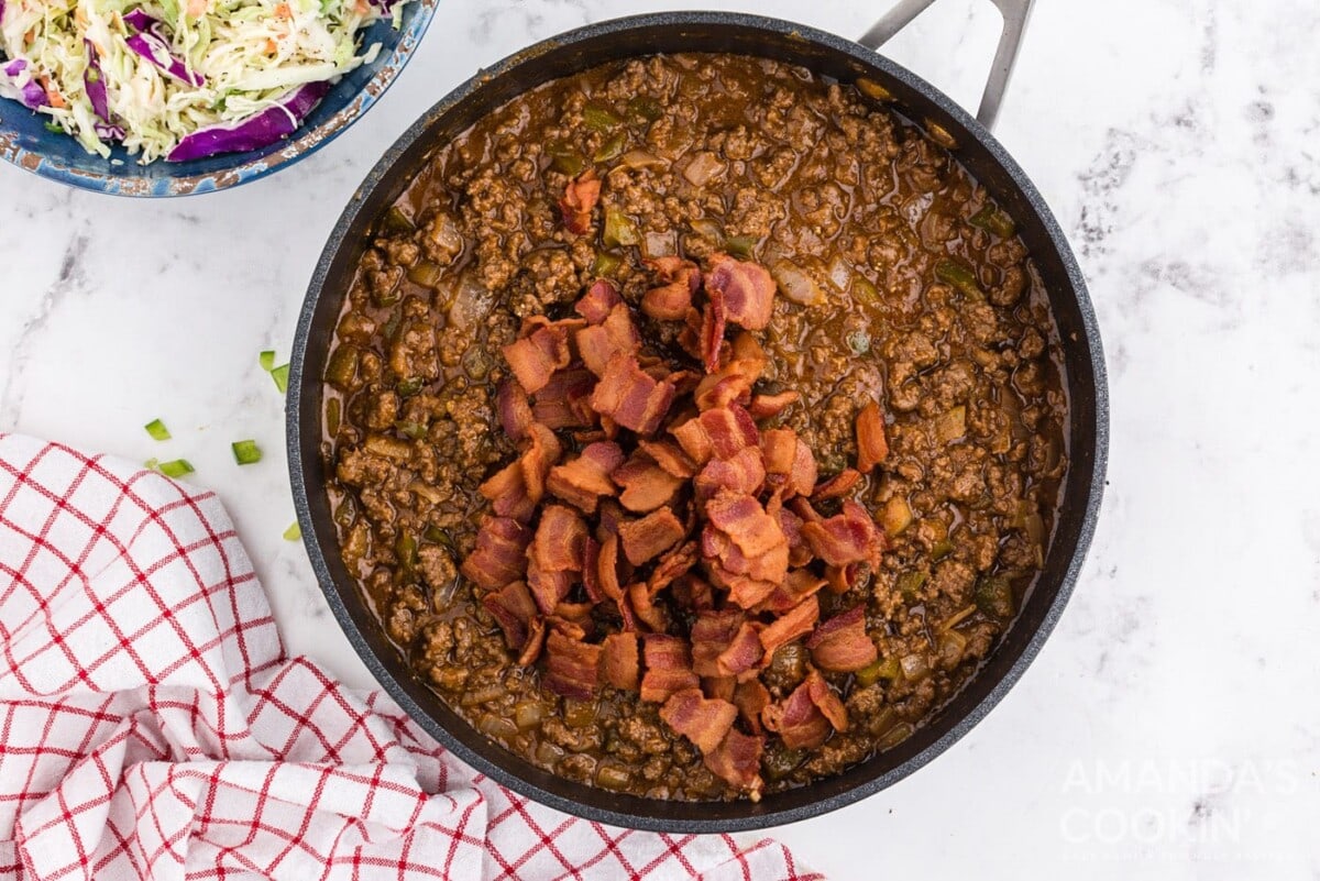 bacon in pan with ground beef