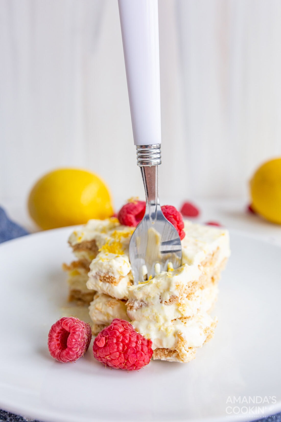fork in slice of lemon icebox cake