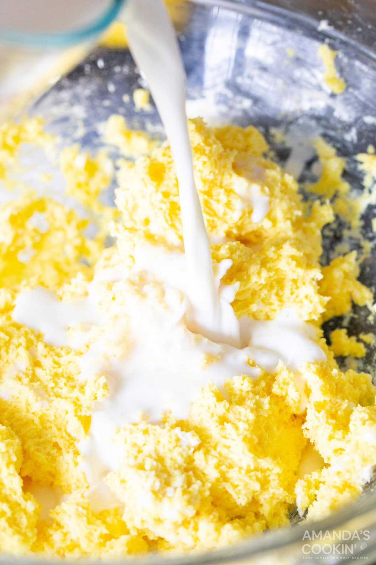 pouring milk into pudding mix