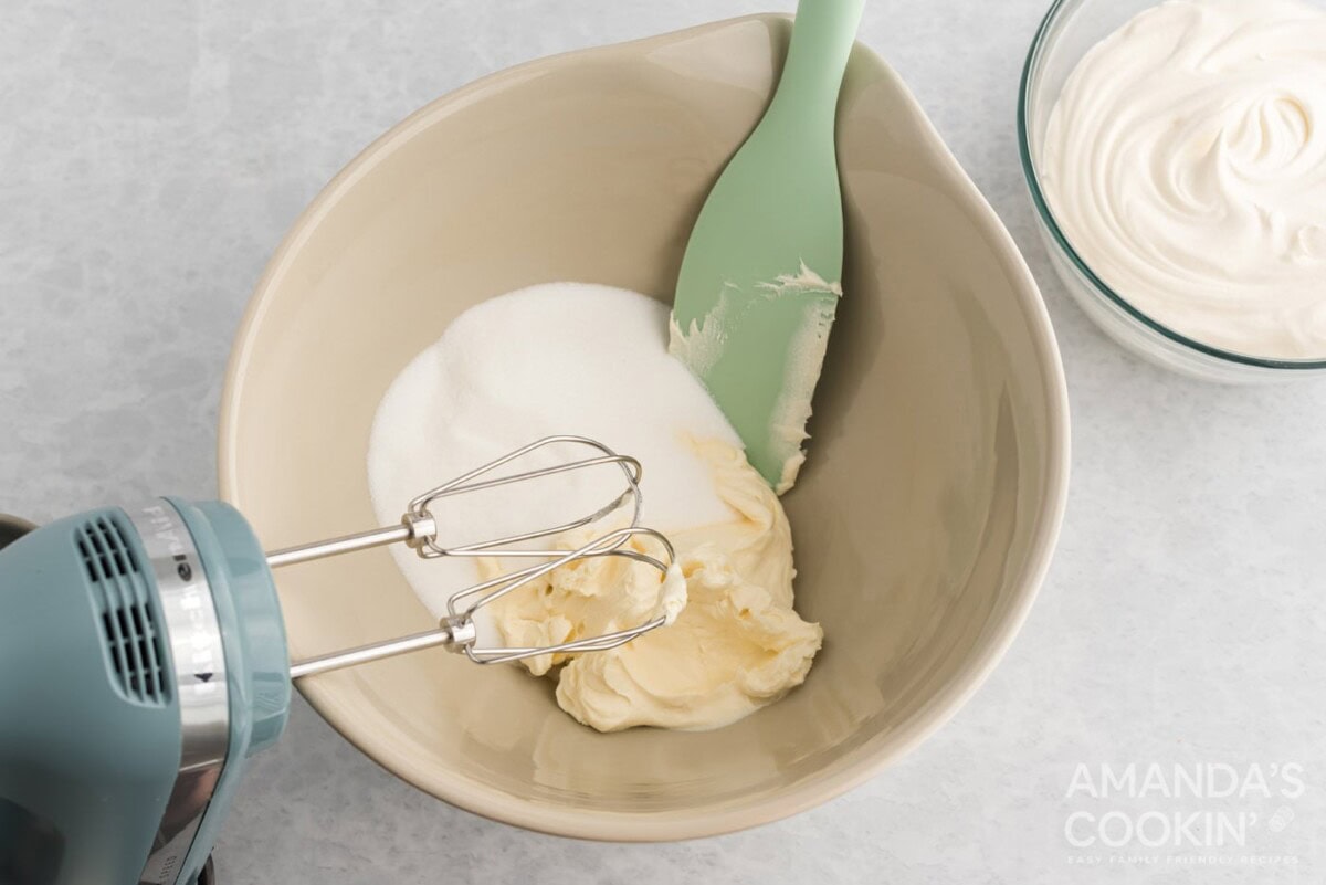 sugar and cream cheese in a mixing bowl