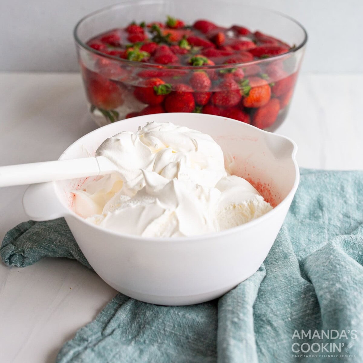 folding cool whip into strawberry jello mixture
