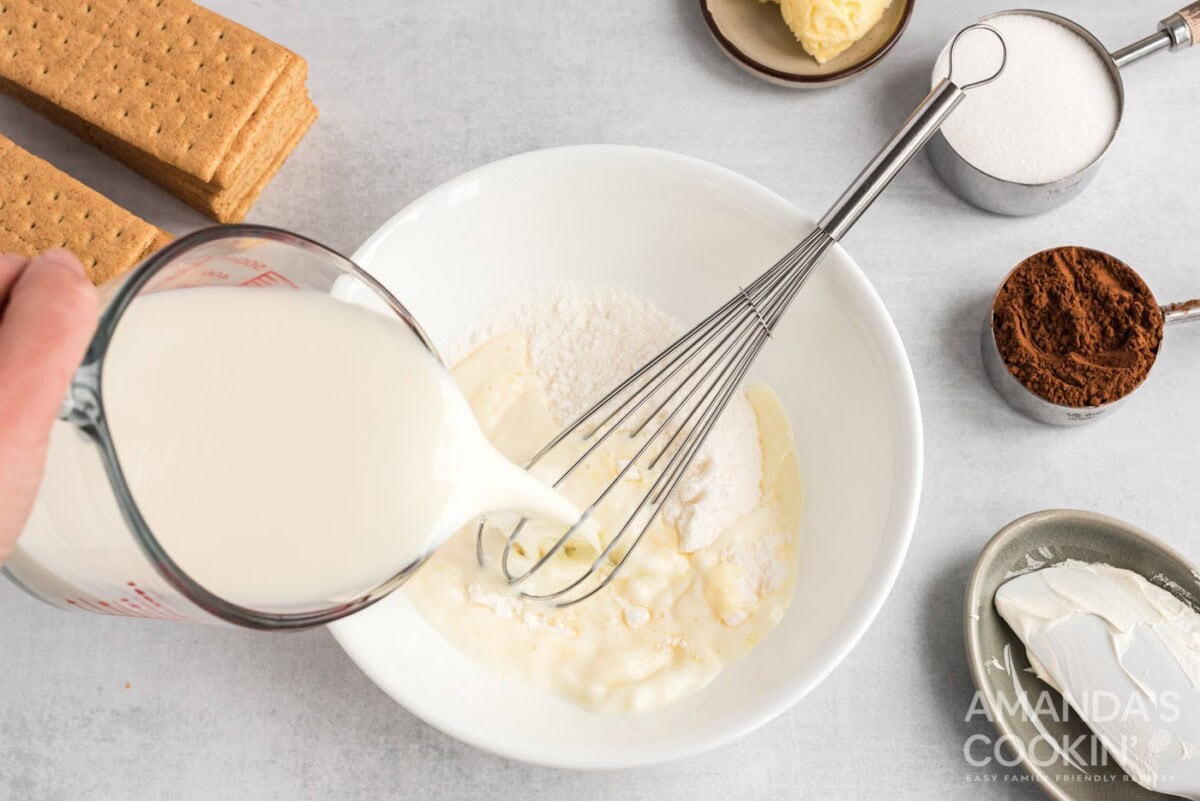 milk pouring into pudding powder
