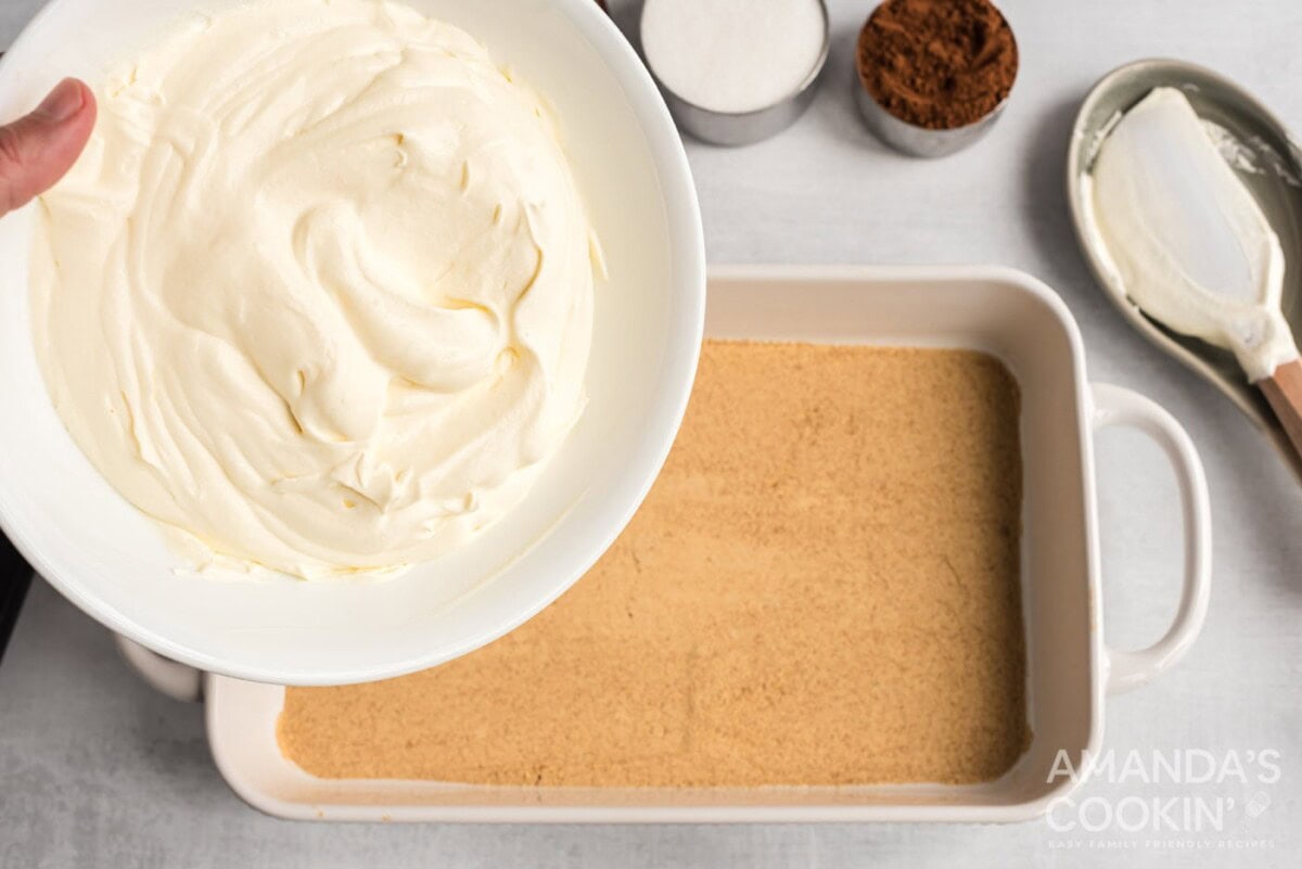 pour pudding mixture over the top of the graham cracker layer