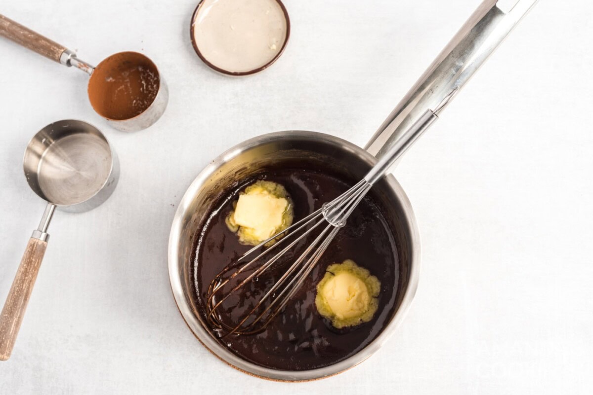 whisking butter in chocolate