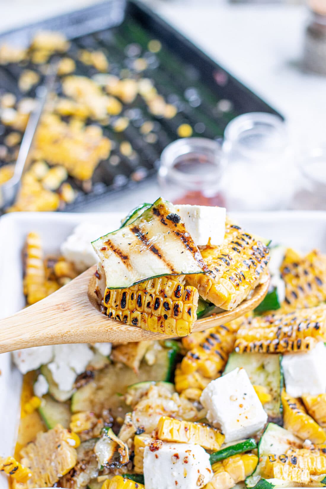 serving some Grilled Corn & Zucchini Salad with Feta