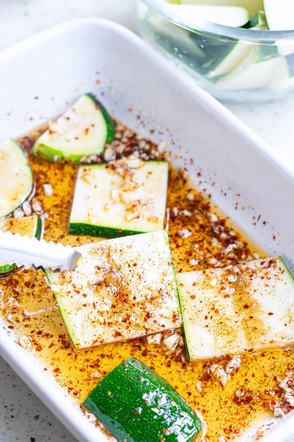 sliced zucchini in marinade