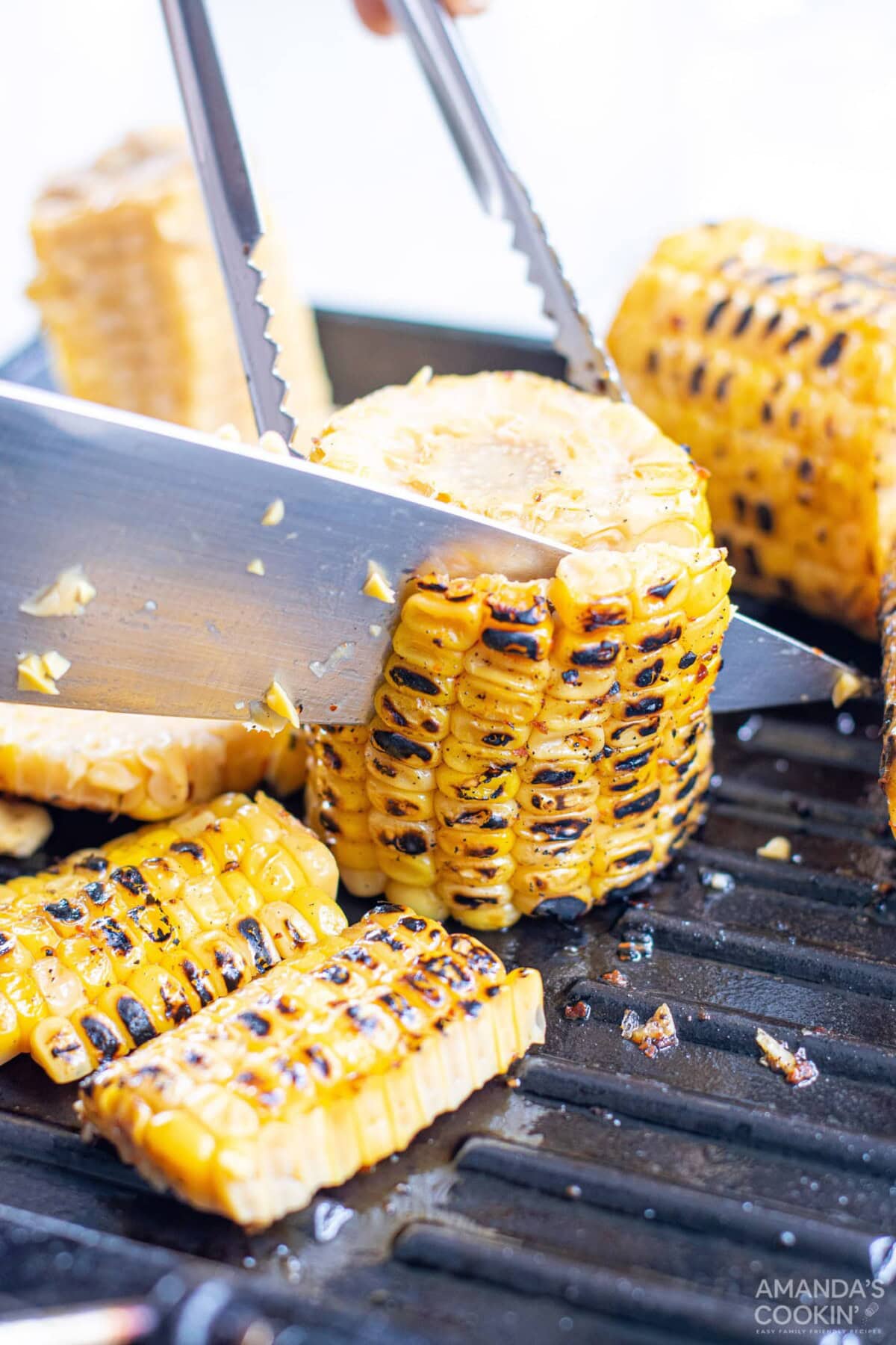 knife cutting corn off the cob