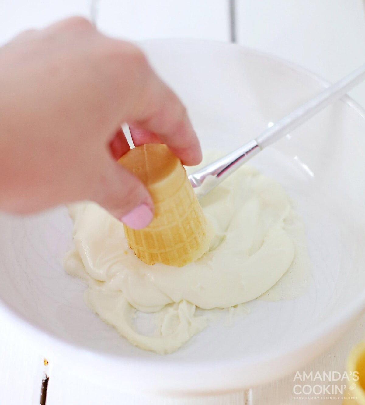dipping ice cream cone in white chocolate