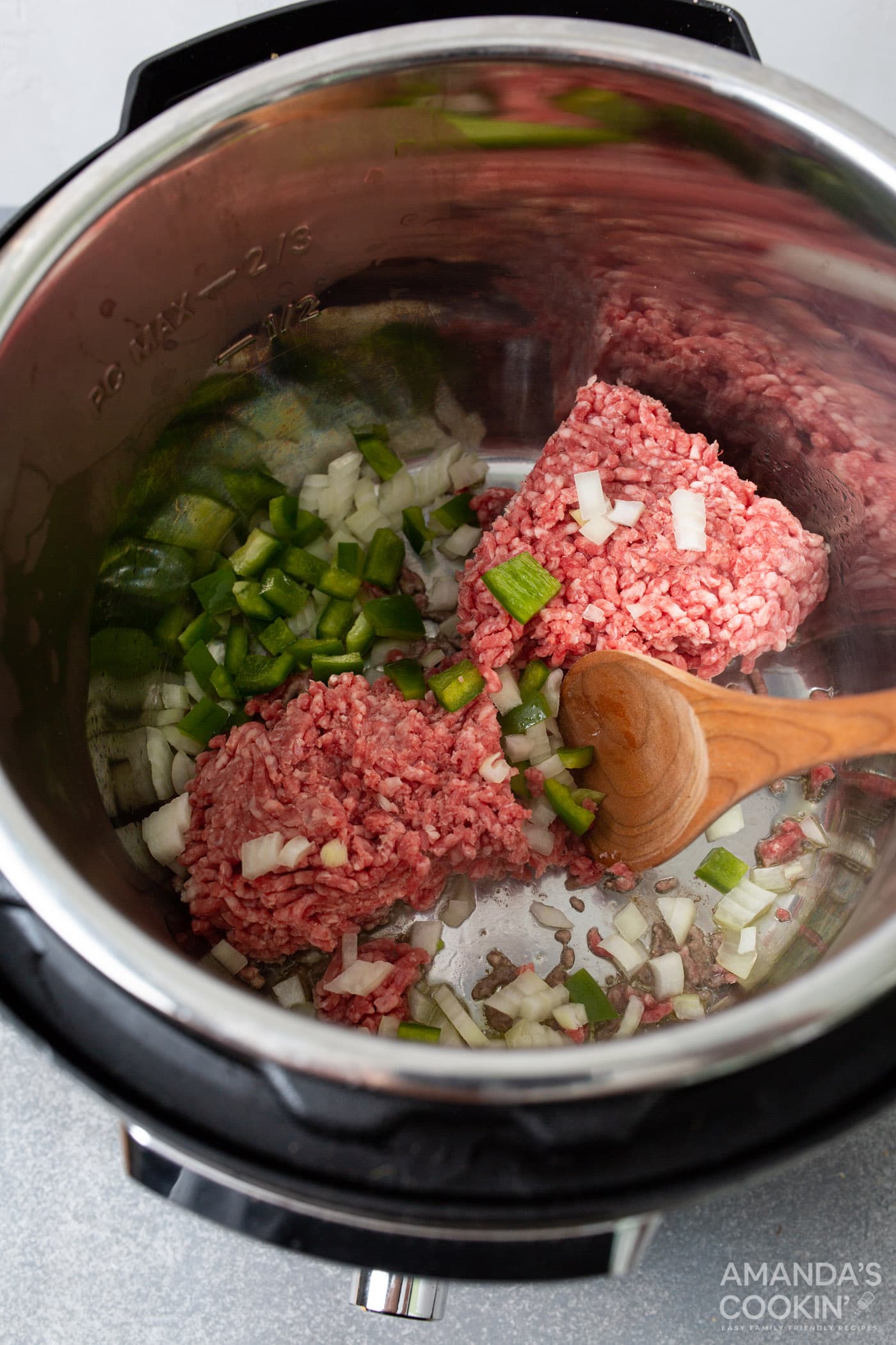 browning ground beef, green pepper, and onion in the instant pot