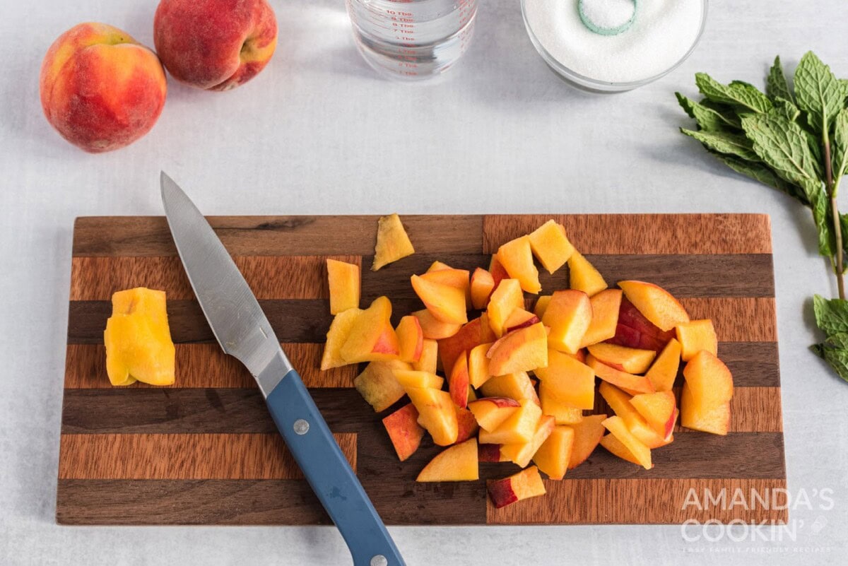sliced peaches on cutting board