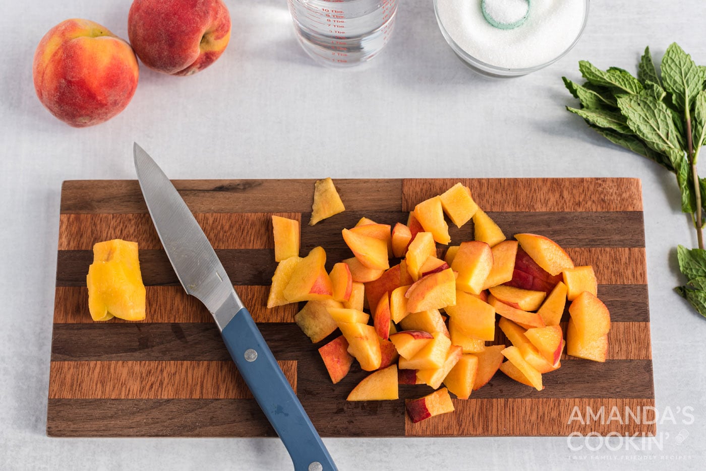 sliced peaches on cutting board