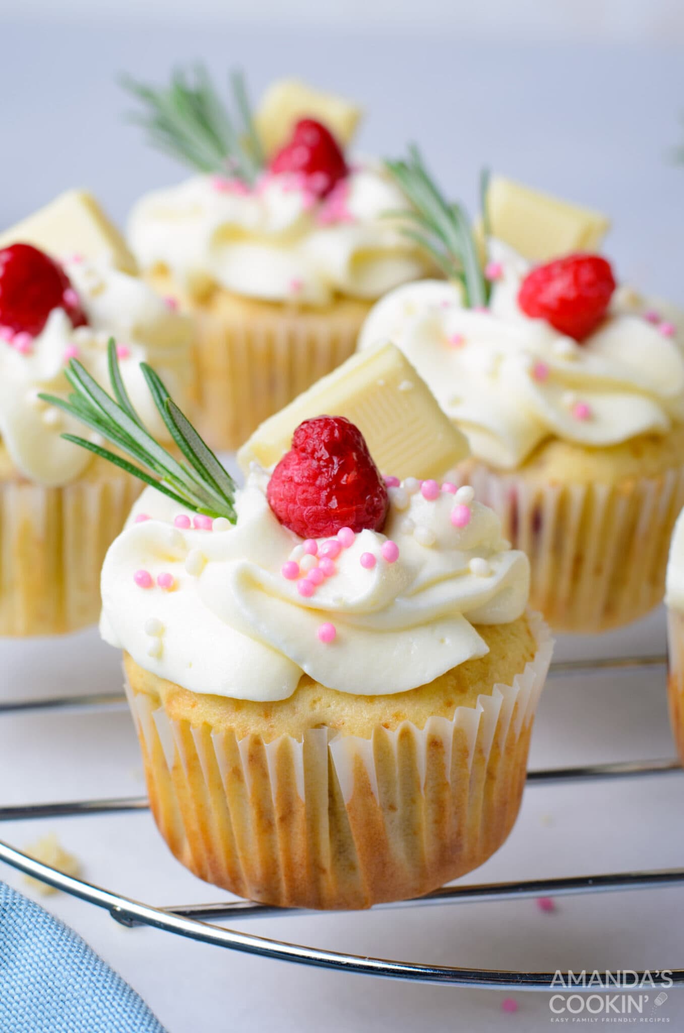 Raspberry White Chocolate Cupcakes on a rack