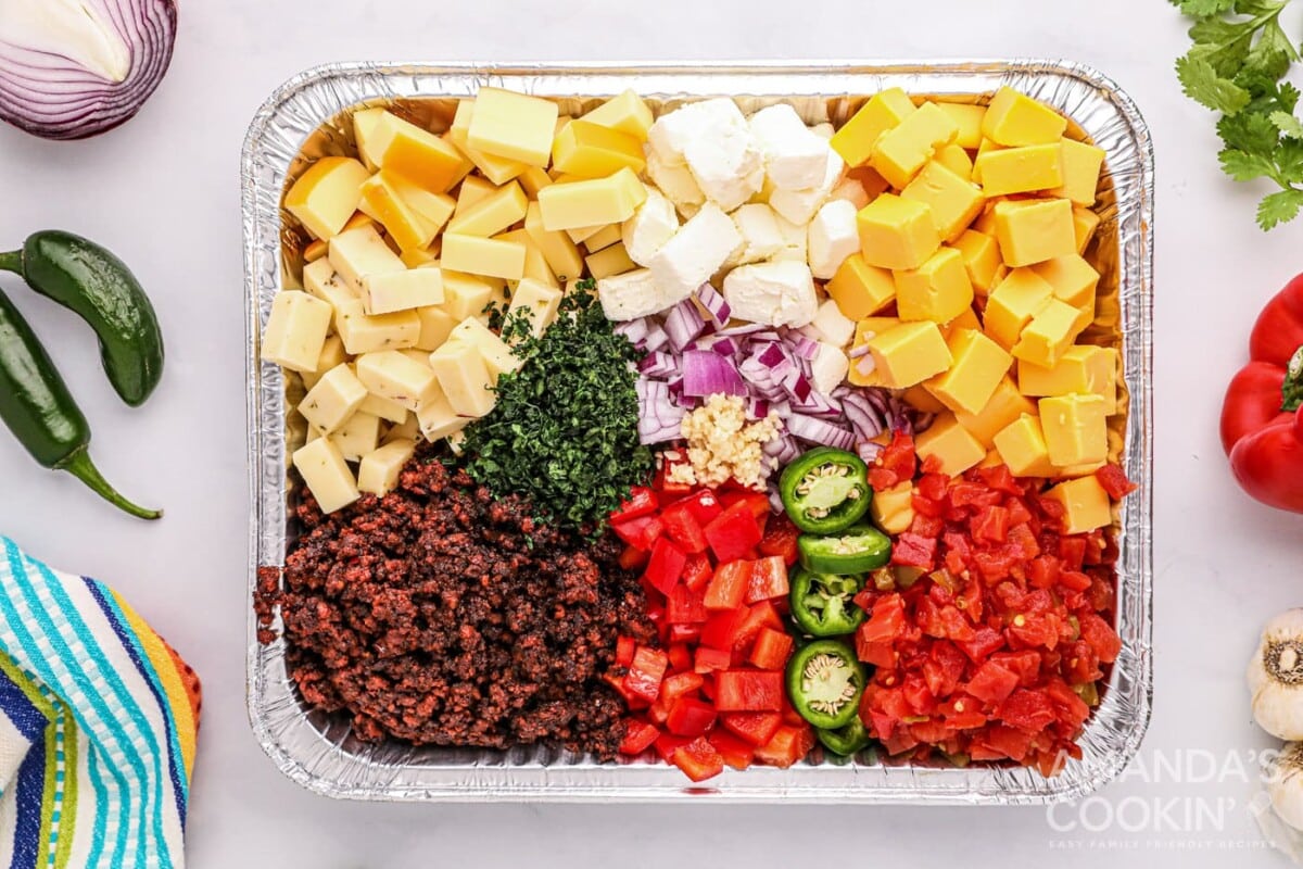 ingredients for Smoked Queso Dip in foil pan